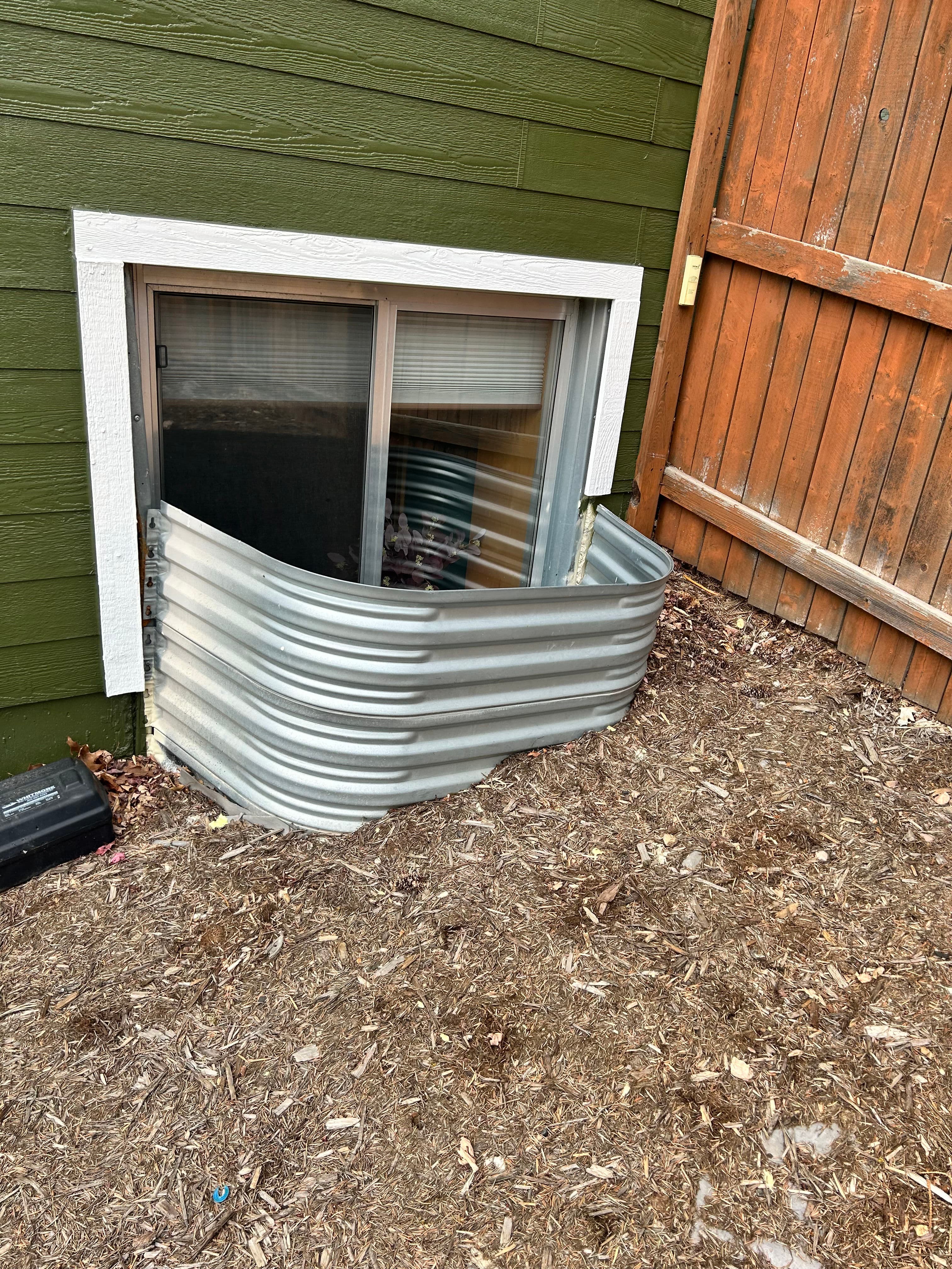 Project Window Well Replacements with Covers Grates and Full Rust Treatment image
