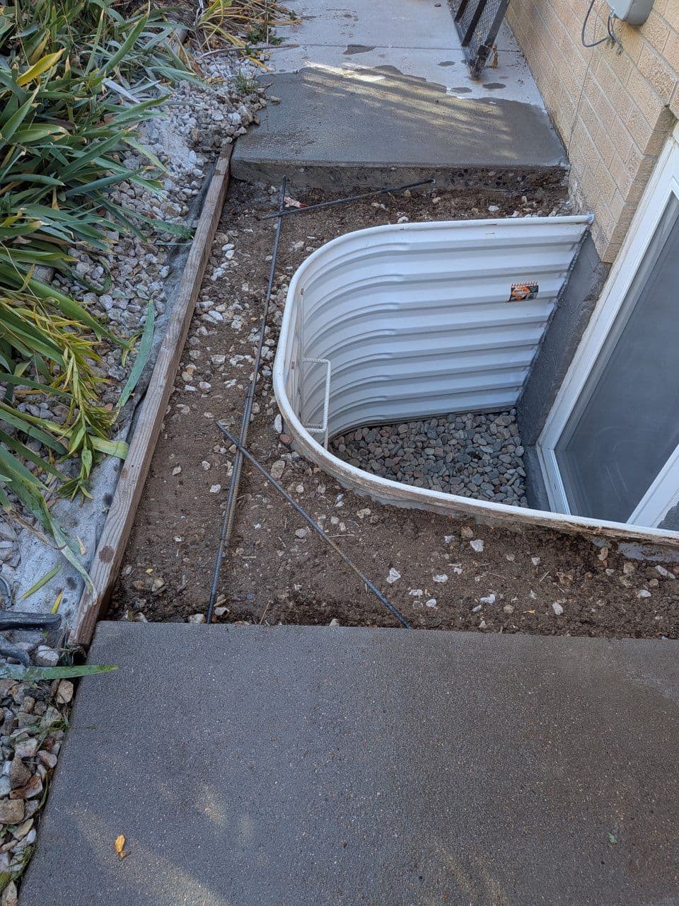 Project Securing Homes with Window Well and Concrete Repair image