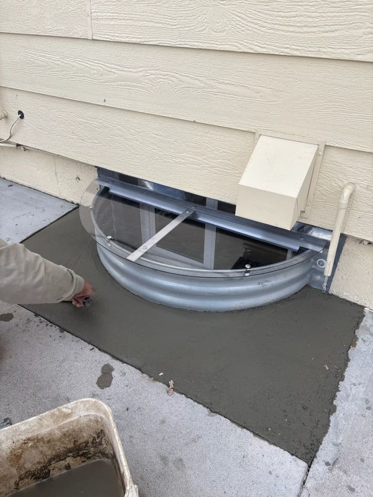 Project Basement Window Well Makeover with Fresh Concrete image