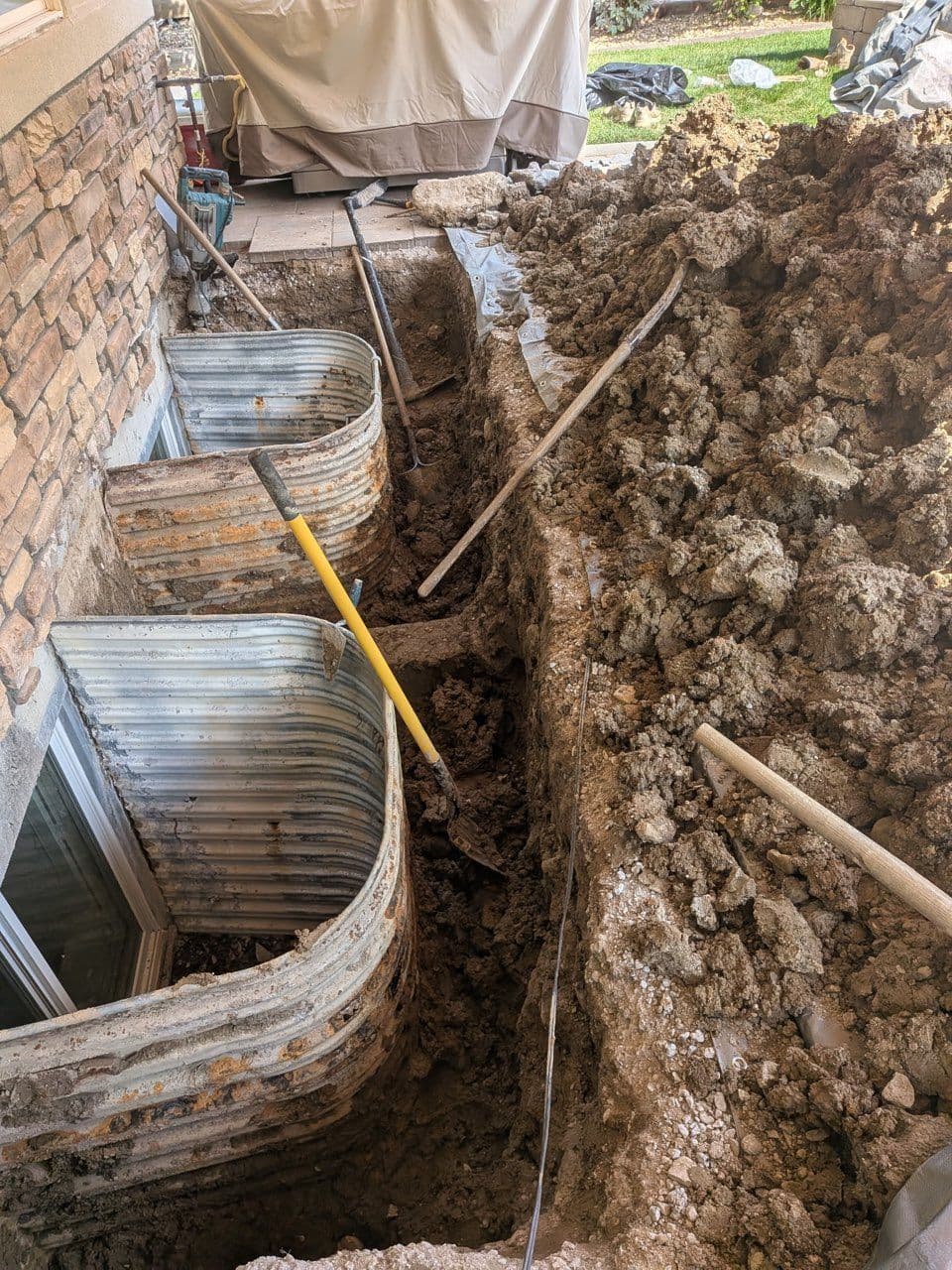 Project Window Well Installation and Paver Patio Redo image