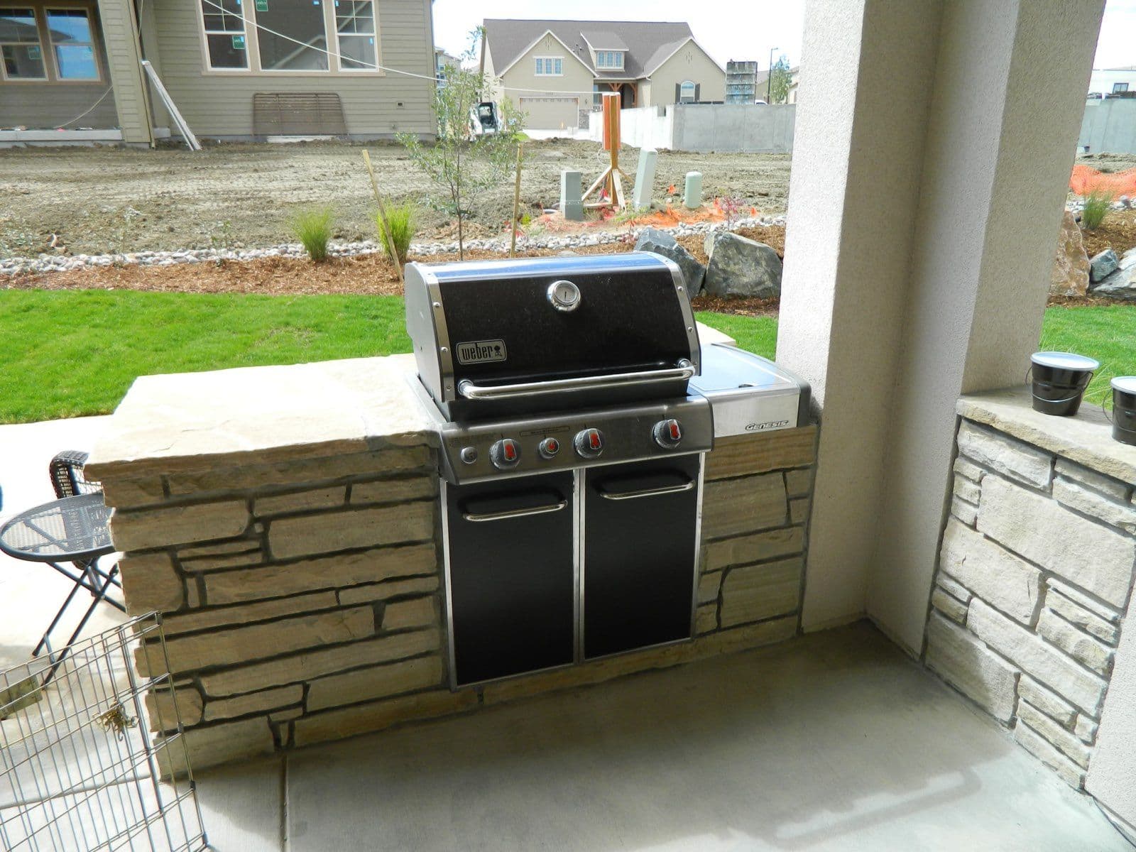 Backyard Dreams Realized with Stunning Stone Fire Pit and Grill image