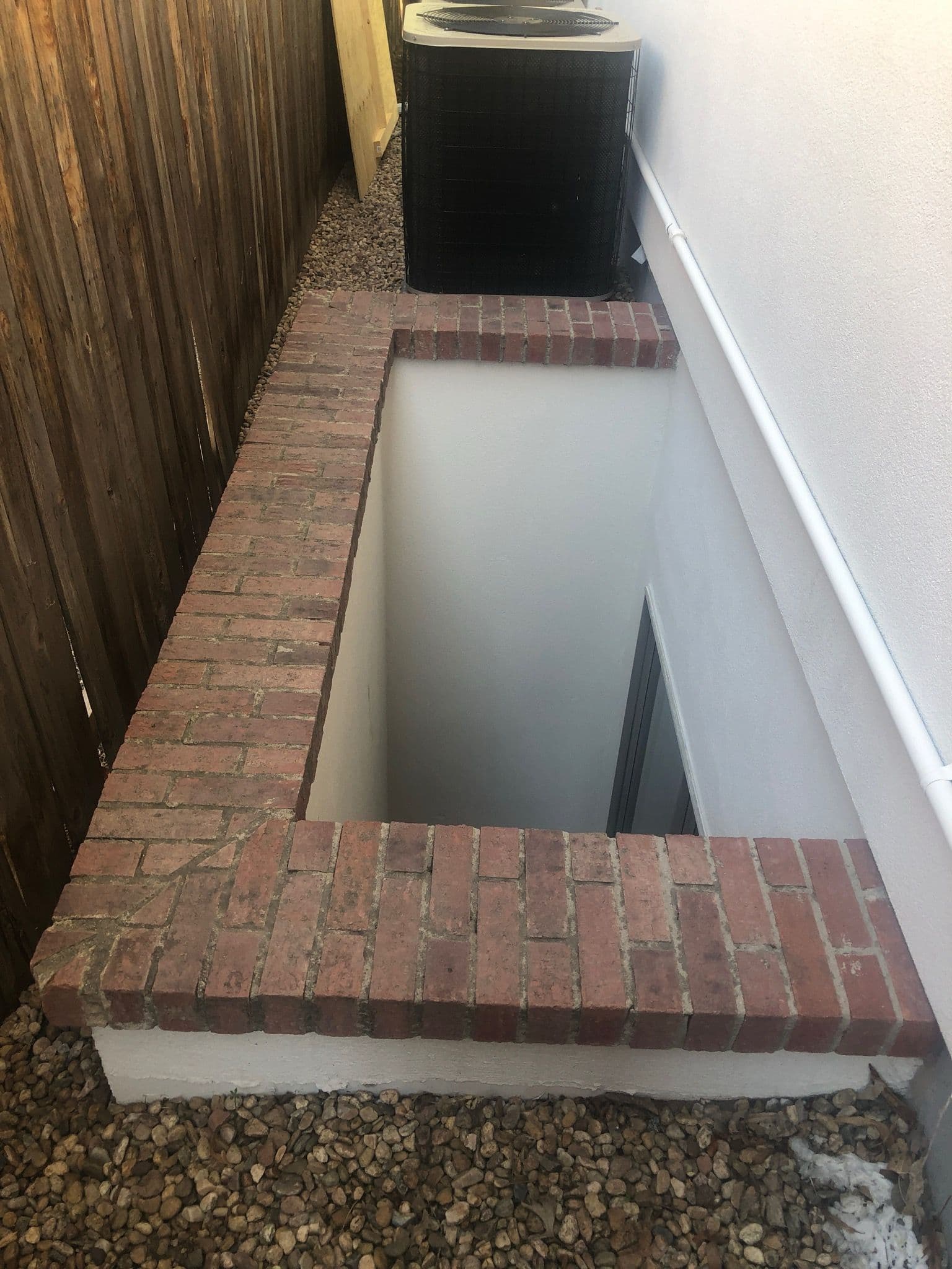 Gallery photos for Crafting Custom Egress Window Wells with Brick Detailing: Image #1
